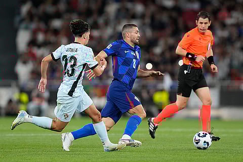2024-25 Nations League Football Portugal vs Croatia: Portugal's Vitinha, left, chases Croatia's Mateo Kovacic